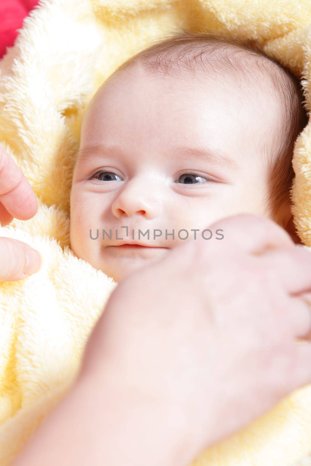 Newborn - close-up focus baby boy with yelow blanket