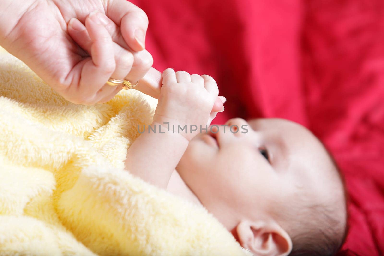 Newborn - first touches with mother hand