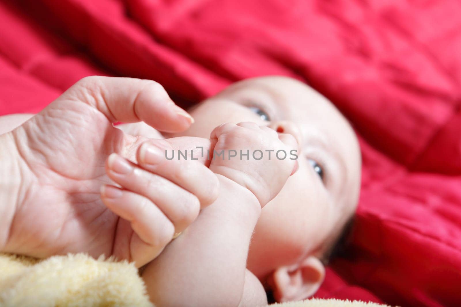 Newborn - first touches with mother hand