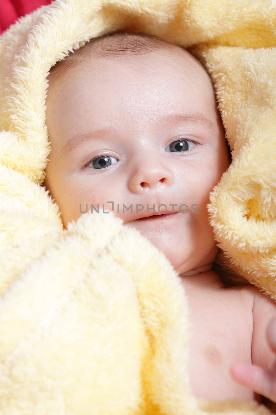 Newborn - close-up focus baby boy with yelow blanket