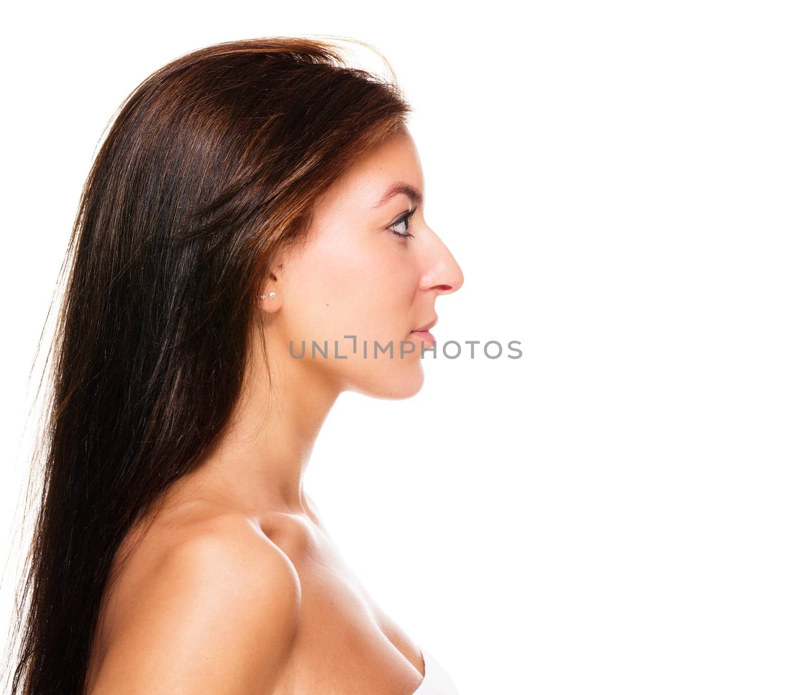 Profile of a young beautiful woman against a white background