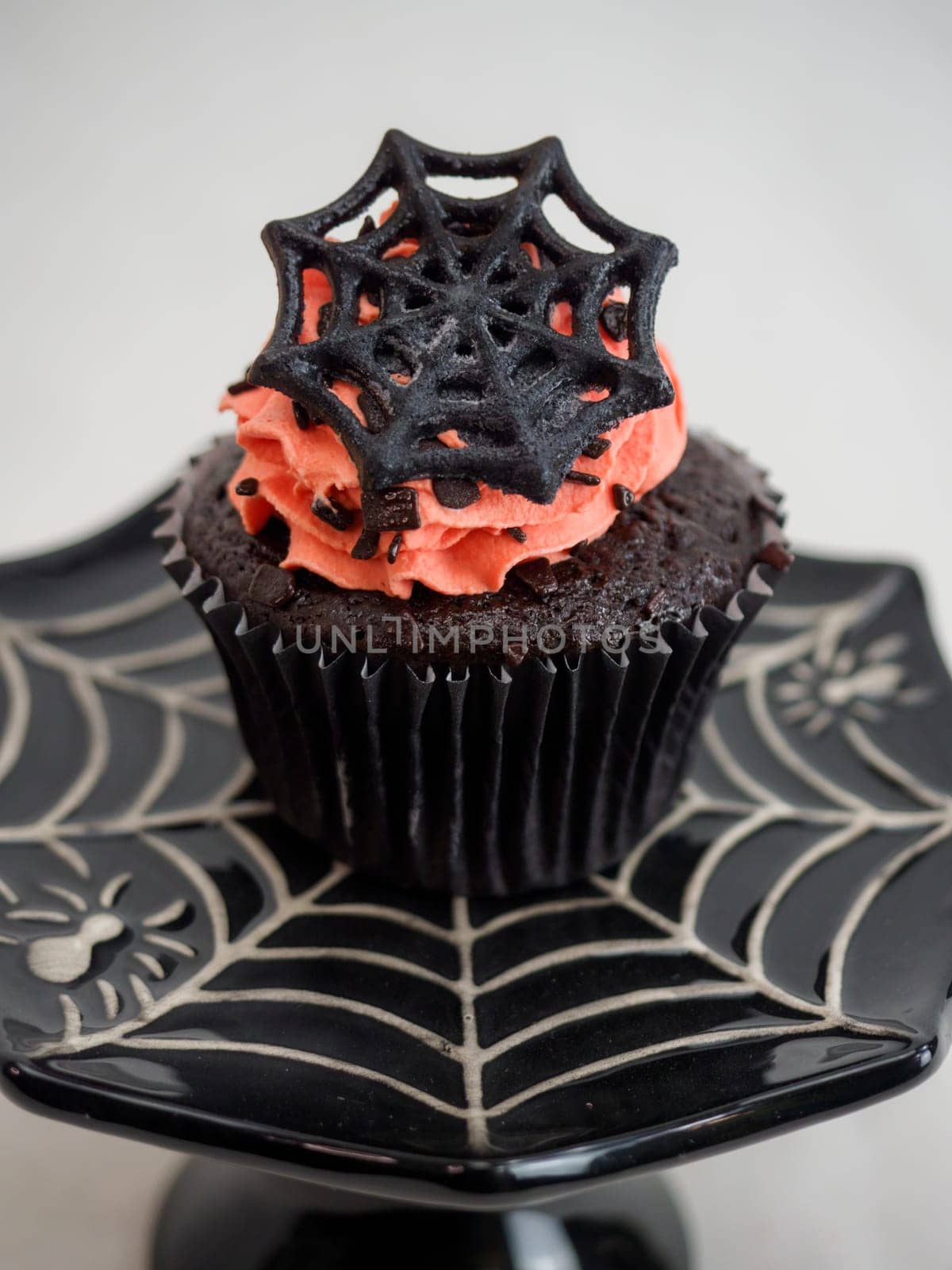 halloween horror themed caupacke muffin on white background by verbano