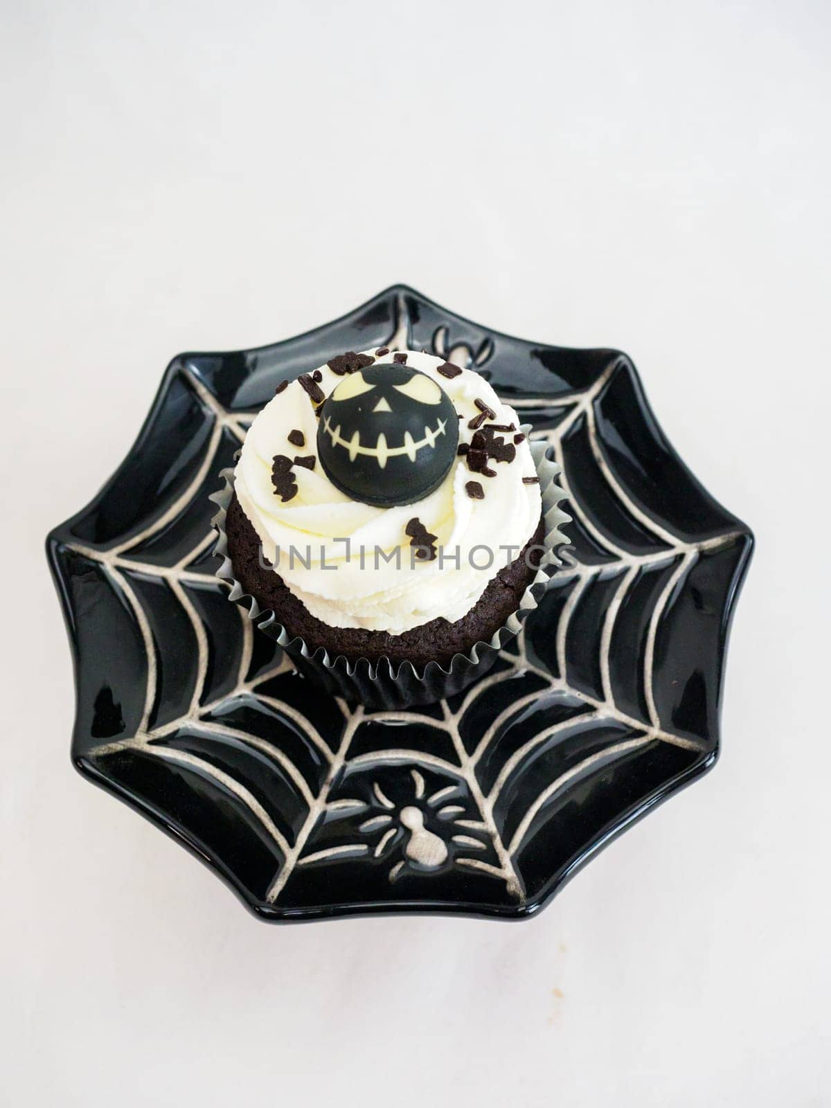 halloween horror themed caupacke muffin on white background by verbano