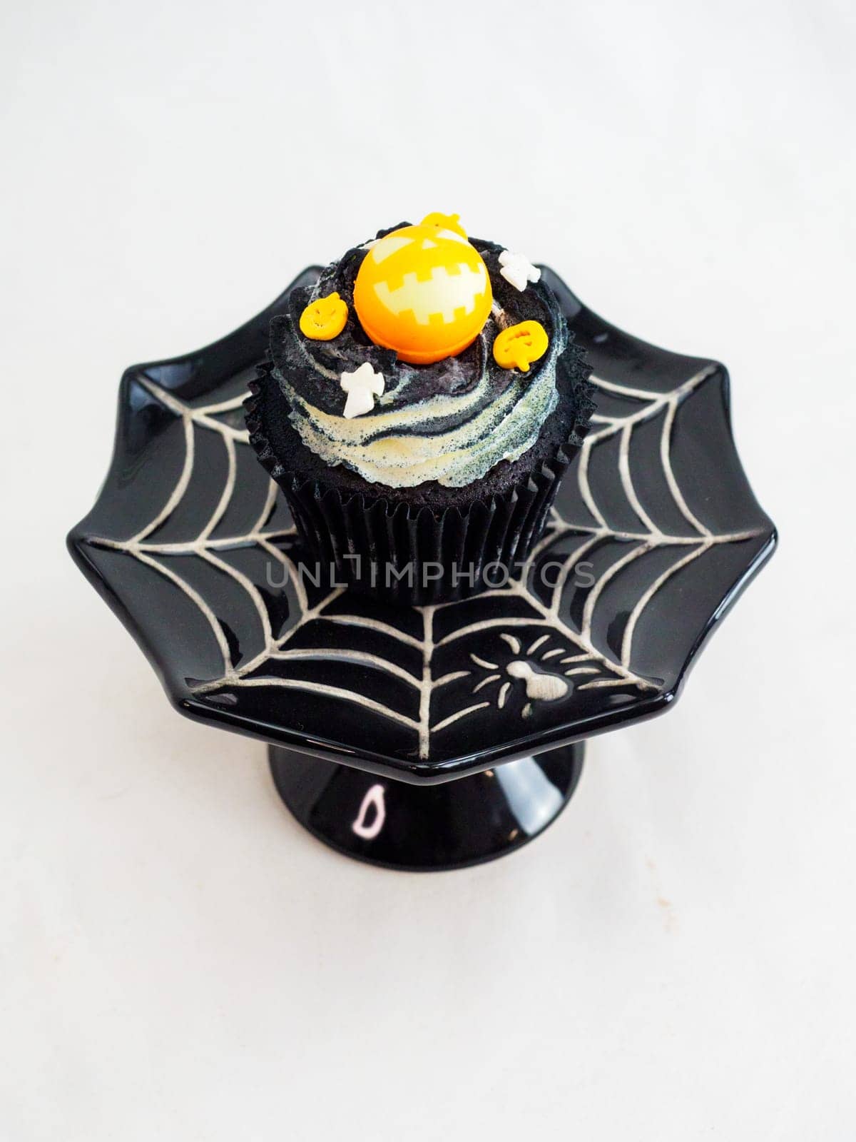 halloween horror themed caupacke muffin on white background by verbano