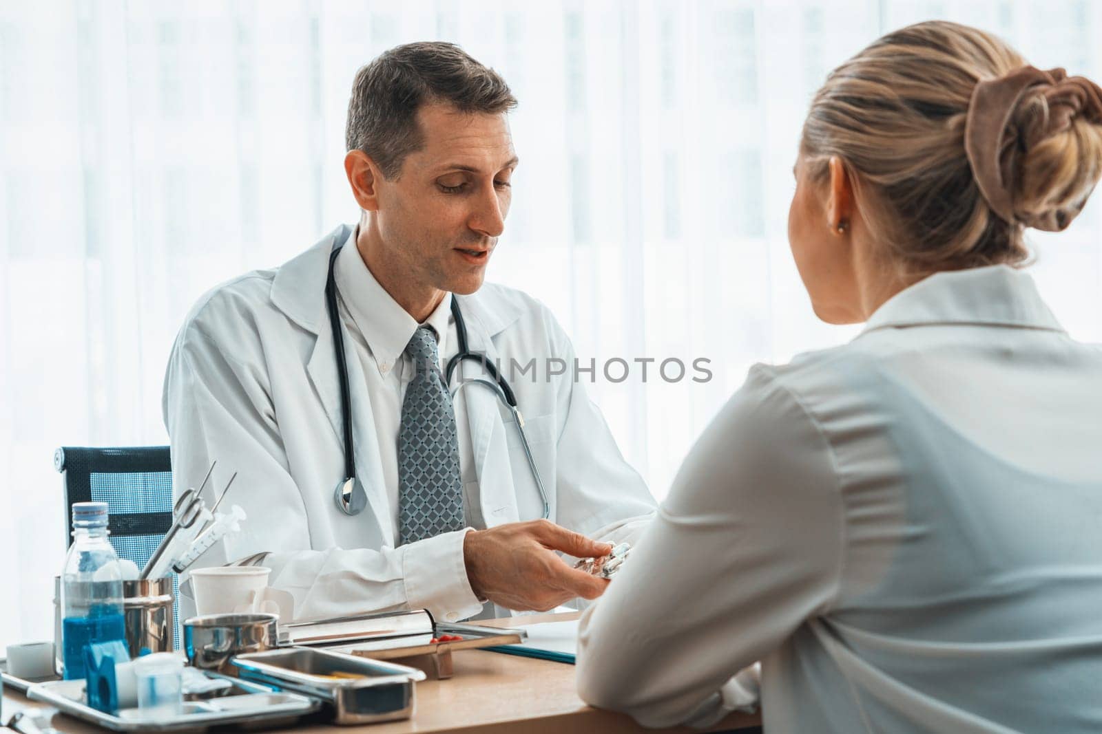 Doctor in professional uniform examining patient at hospital or medical clinic. Health care , medical and doctor staff service concept. Jivy
