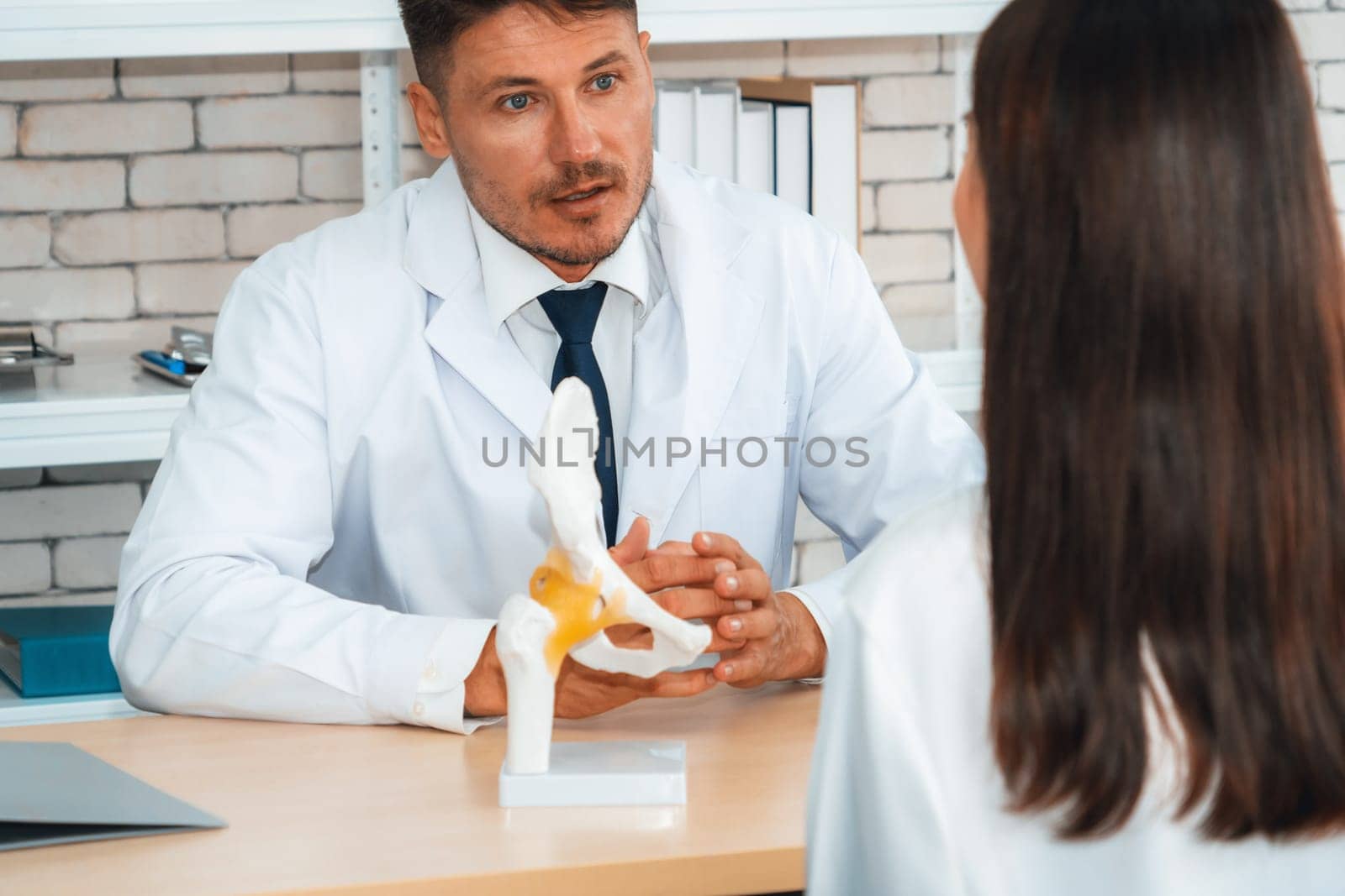 Doctor in professional uniform examining patient at hospital or medical clinic. Health care , medical and doctor staff service concept. Jivy