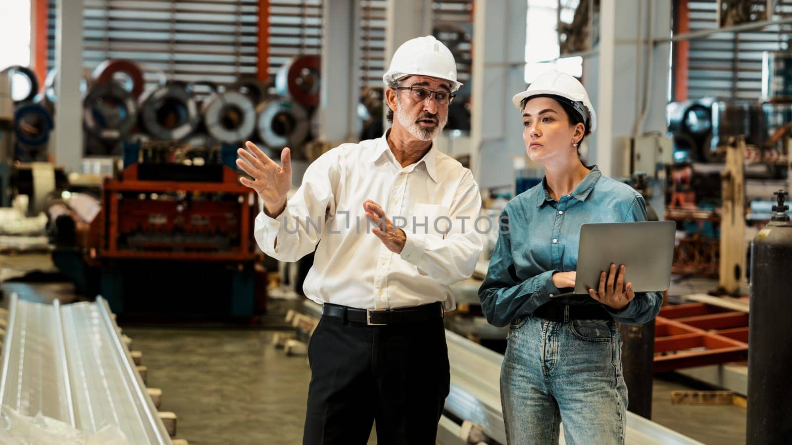 Factory manager or executive make visit metalwork manufacturing factory tour and inspect heavy steel industrial machinery showcase leadership quality as engineering inspection supervisor. Exemplifying