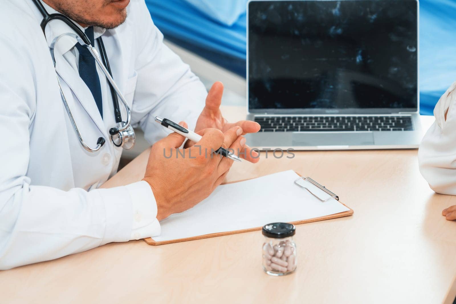 Doctor in professional uniform examining patient at hospital or medical clinic. Health care , medical and doctor staff service concept. Jivy