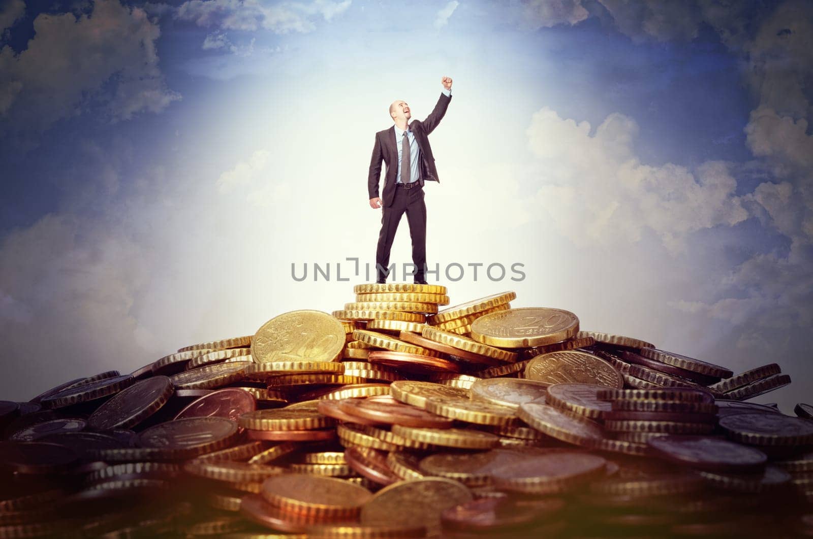 happy man on top od euro coin hill