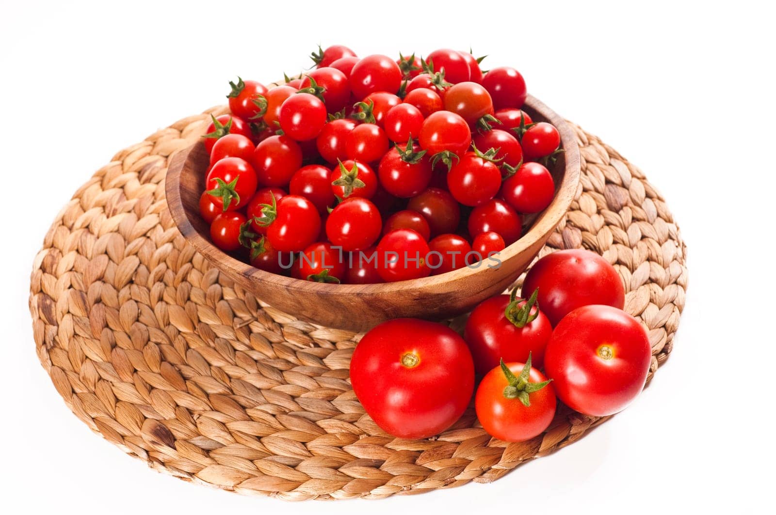 fresh cherry tomatoes in wooden bowl