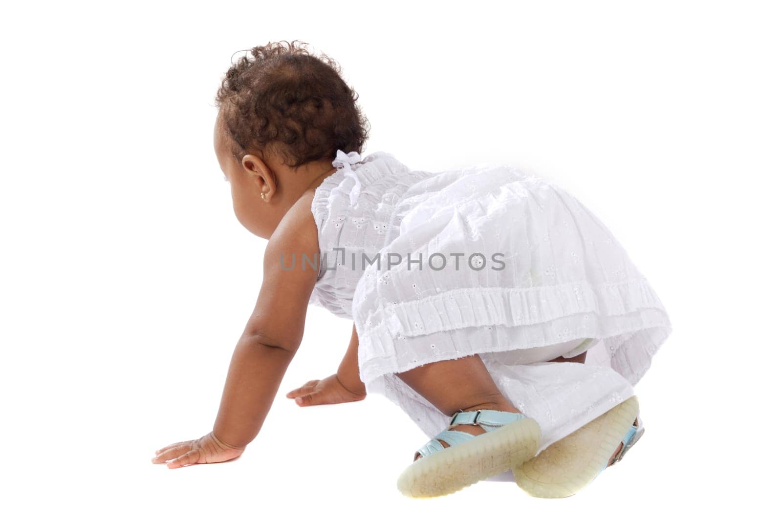 adorable baby learning to walk a over white background