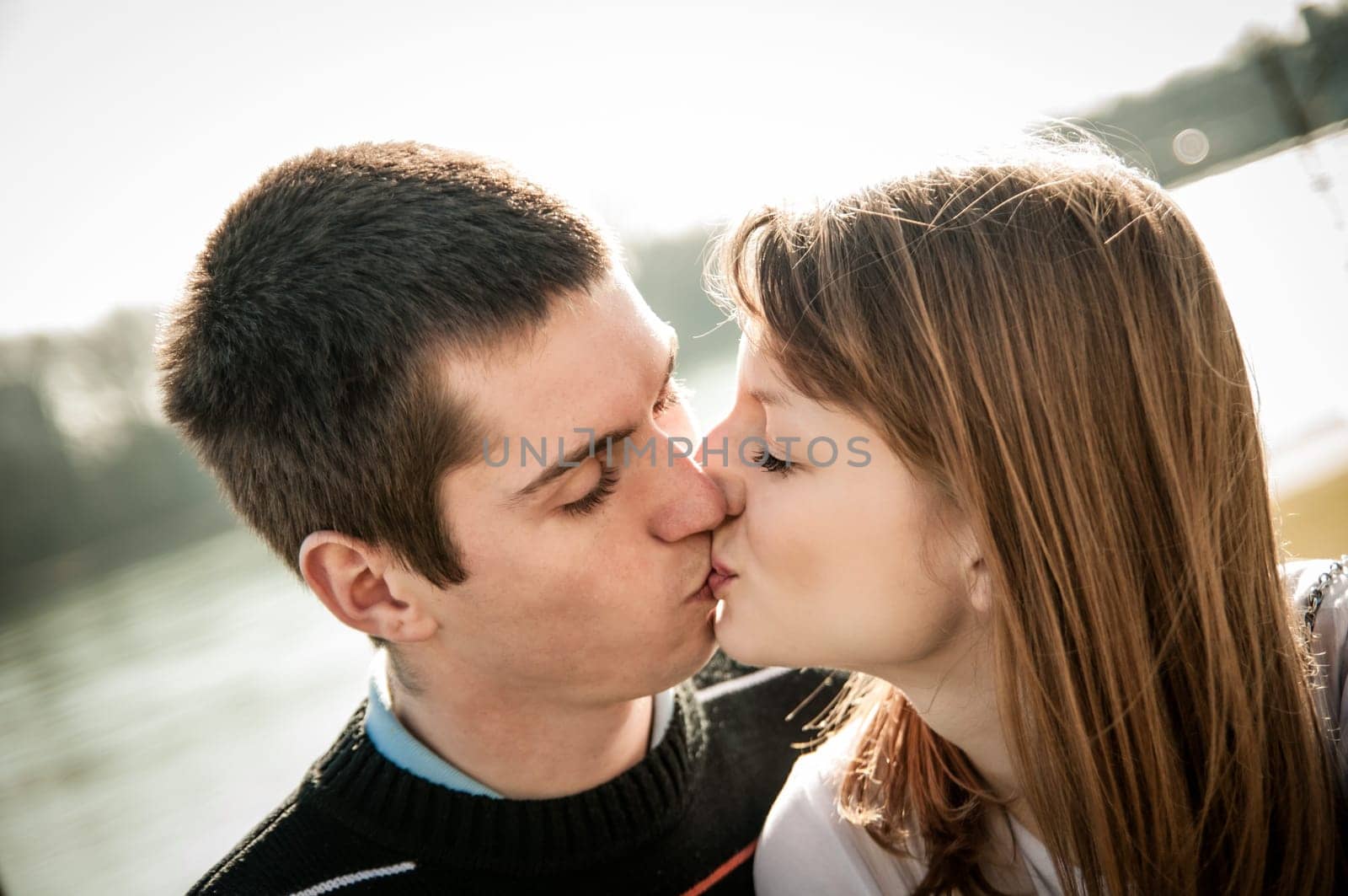Young happy couple looking on each other - outdoor lifestyle portrait