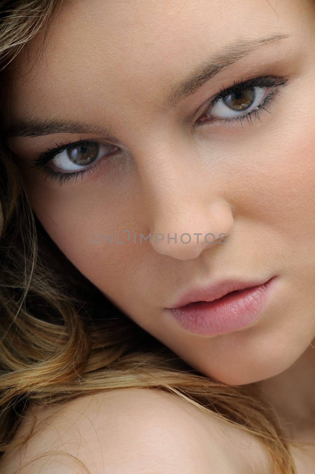 Portrait of young beautiful woman - isolated on white