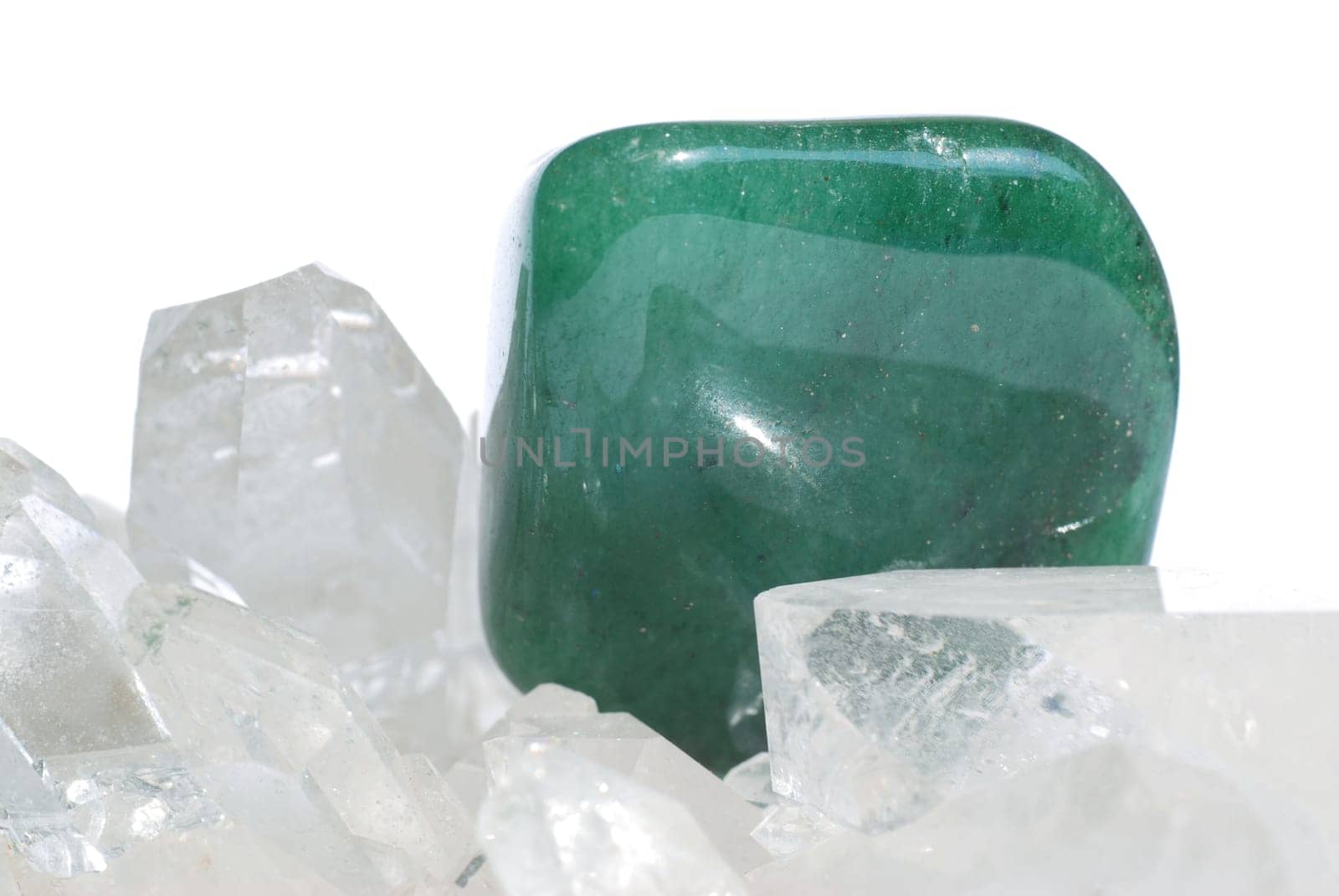 Aventurine gem laid on quartz crystals