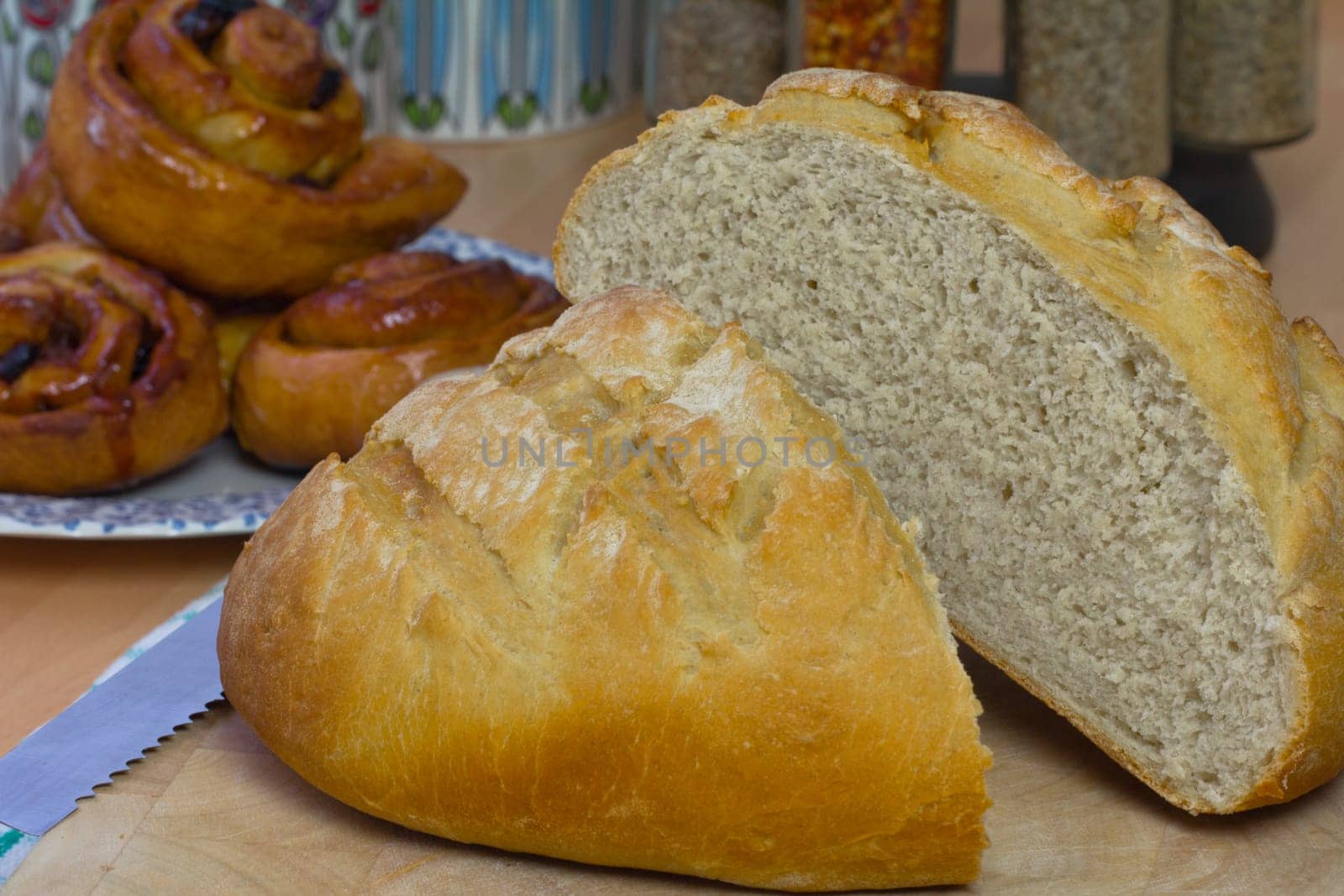 A loaf of bread freshly baked and cut in half