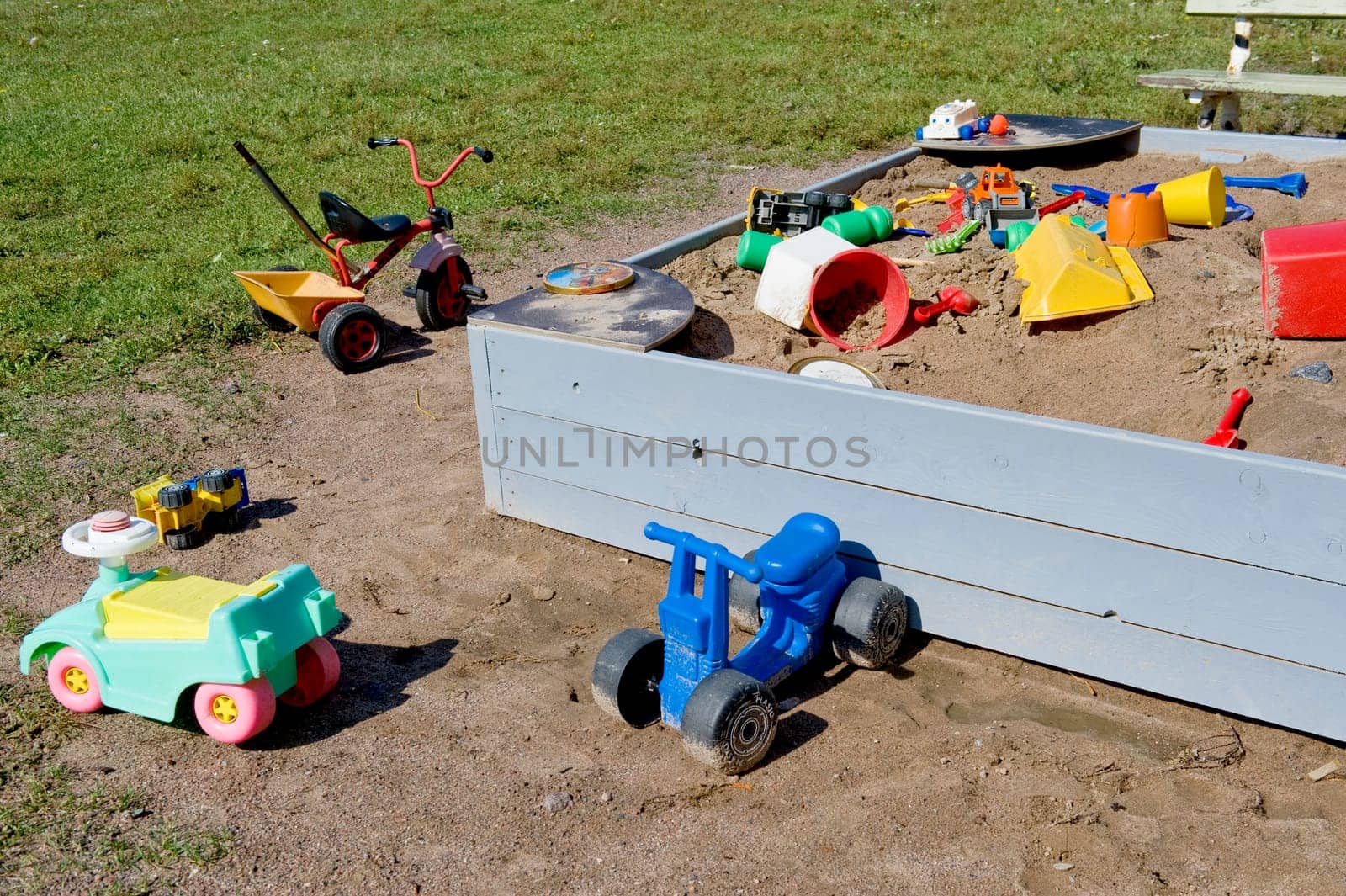 The left toys near a sandbox, taken as clouseup.
