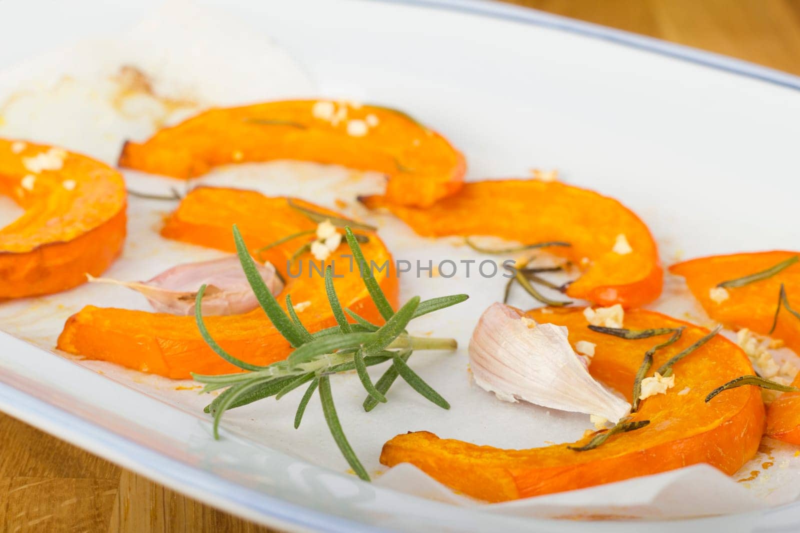 Baked pumpkin wedges with rosemary and garlic
