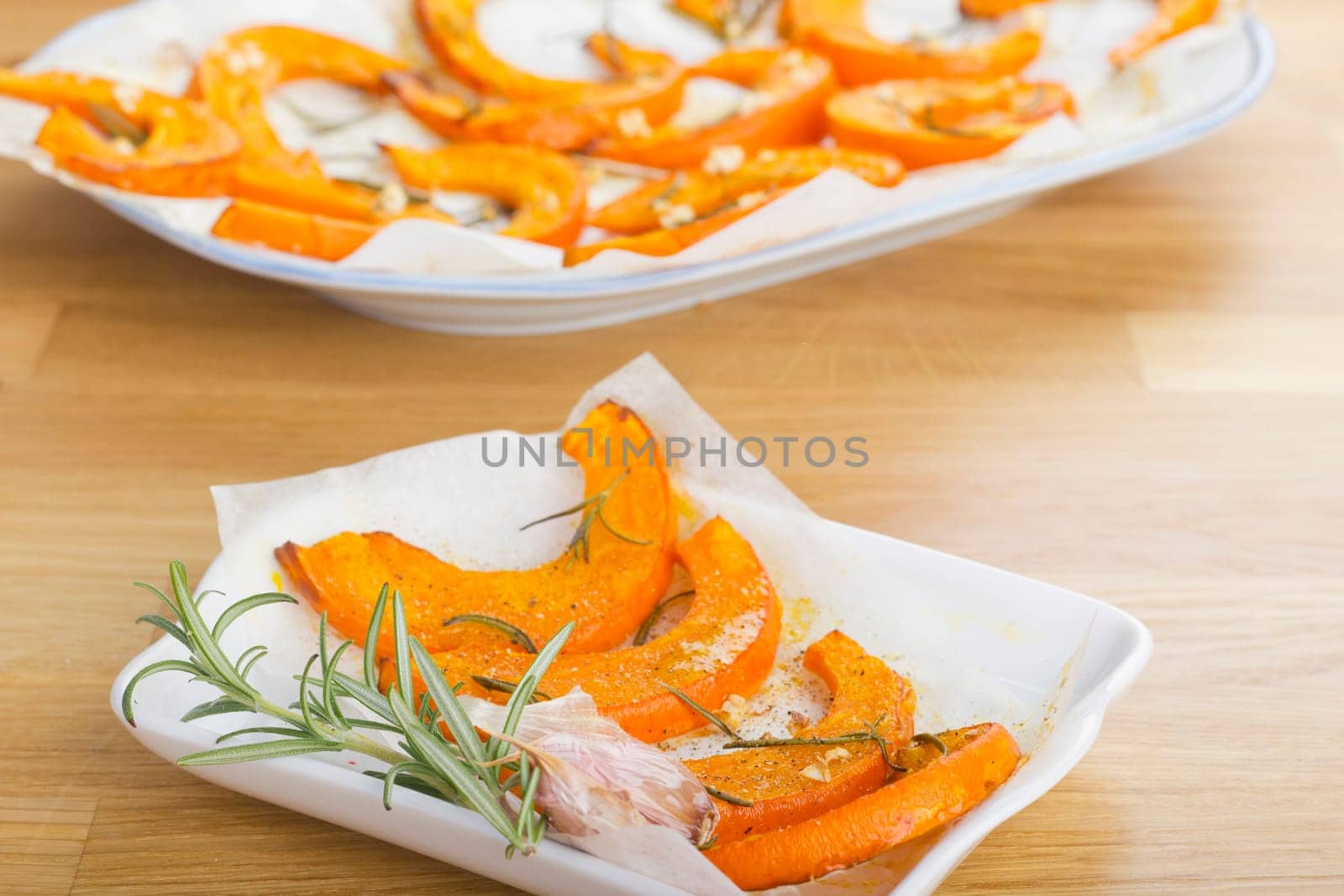 Baked pumpkin wedges with rosemary and garlic