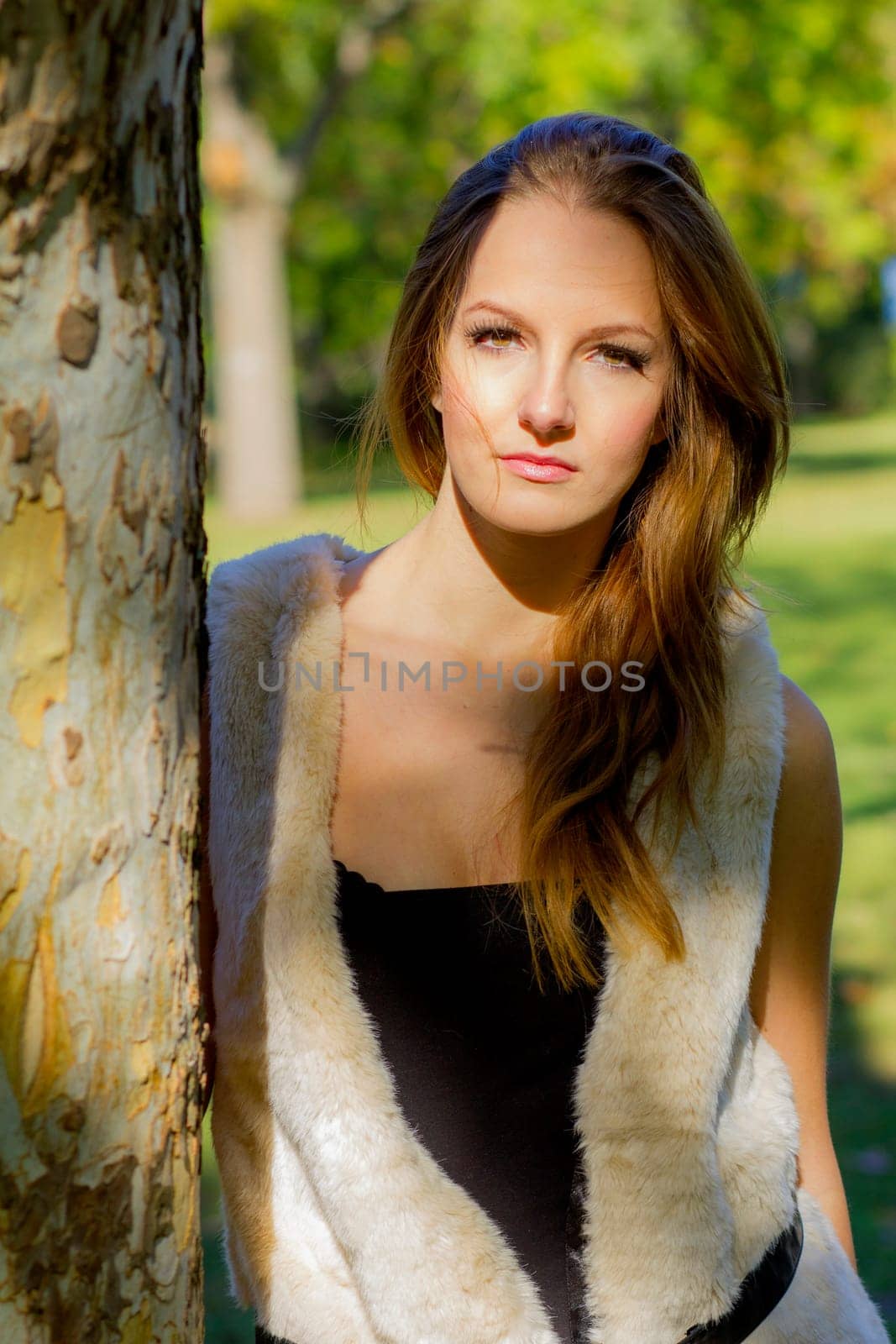 Young, beautiful woman in the city park