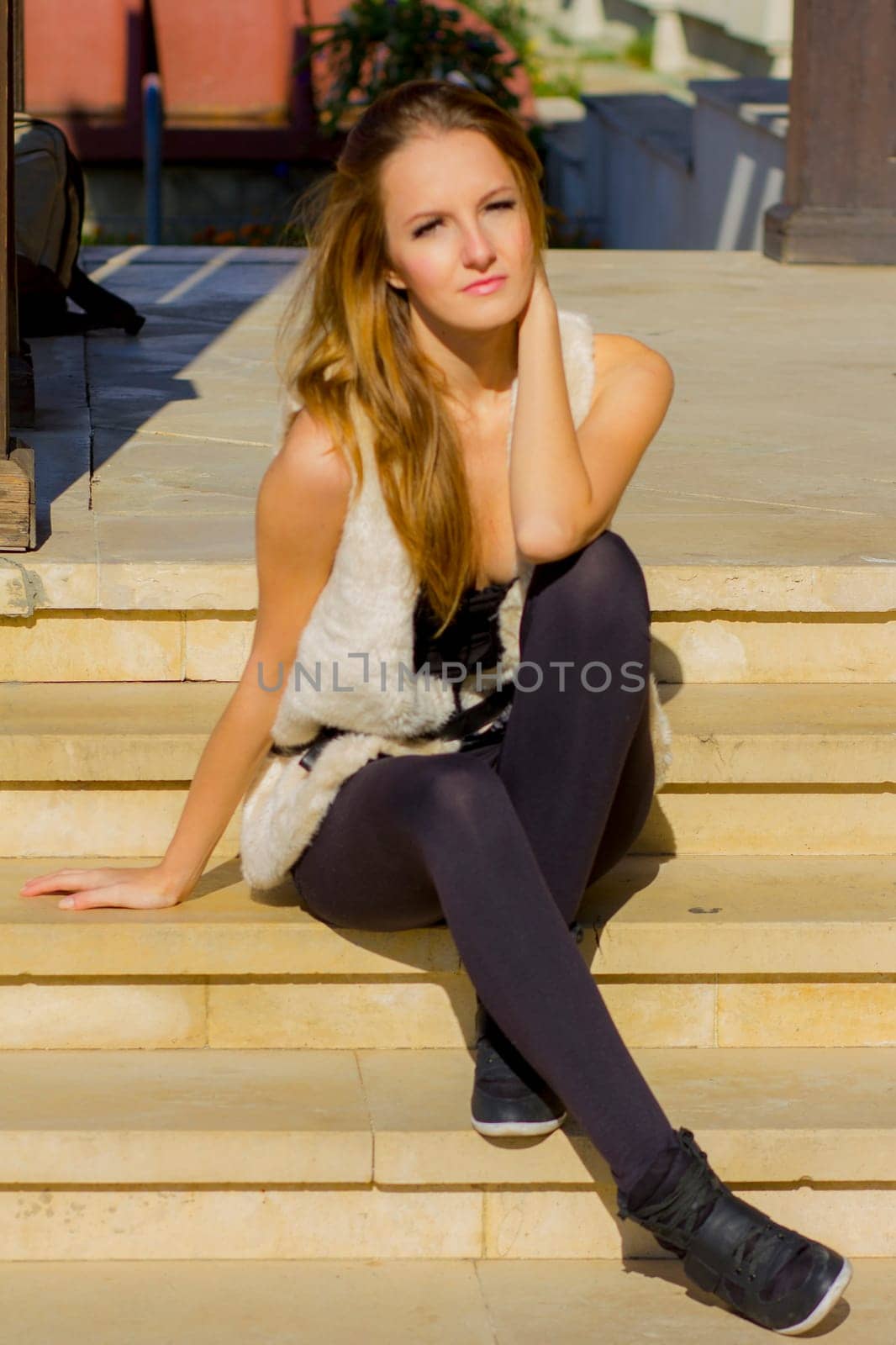 Young, beautiful woman in the city park