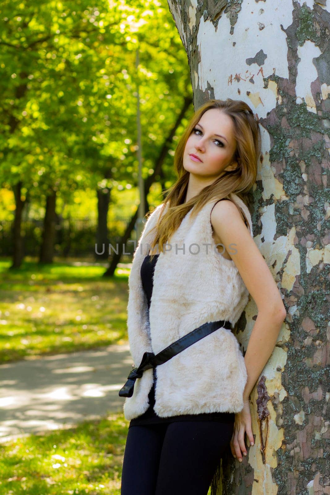 Young, beautiful woman in the city park