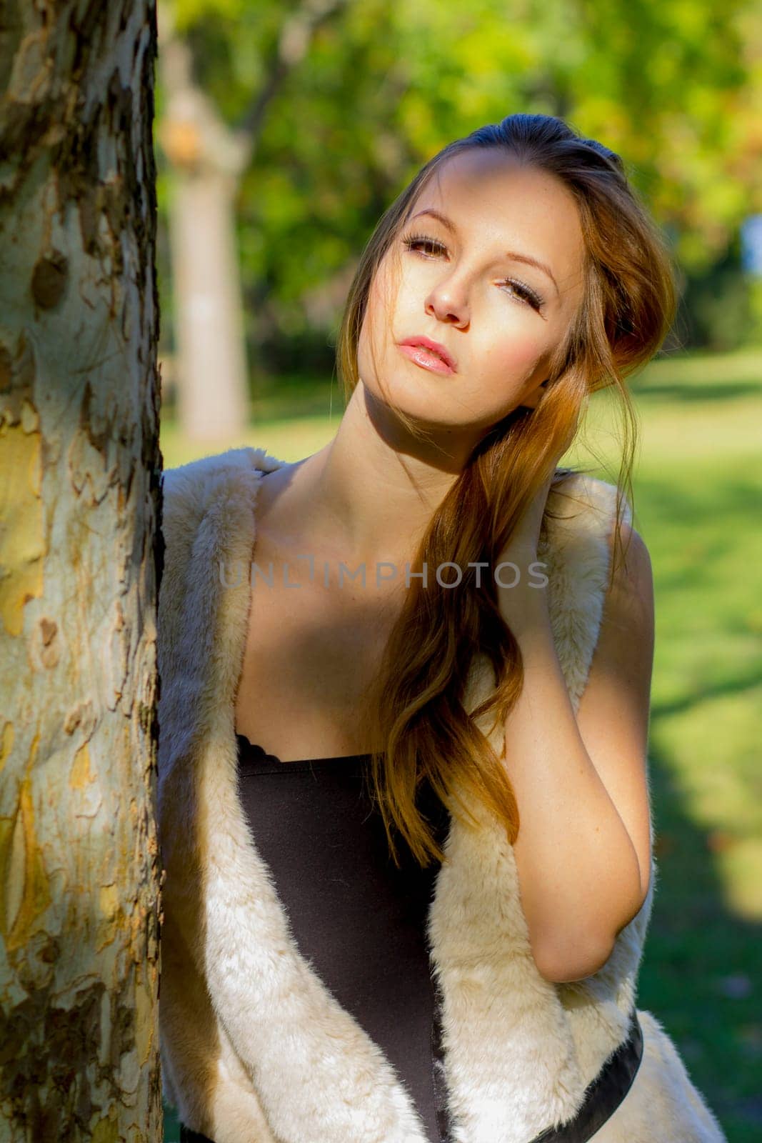 Young, beautiful woman in the city park