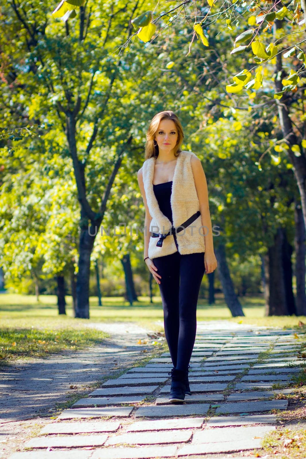 Young, beautiful woman in the city park