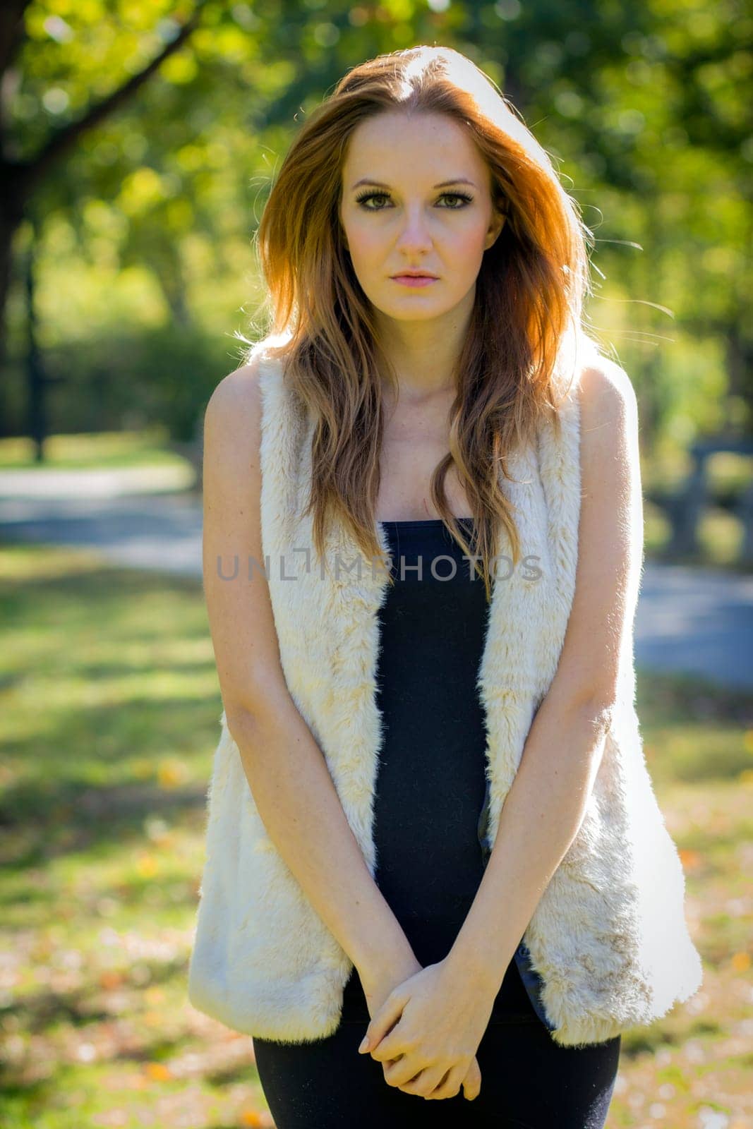 Young, beautiful woman in the city park