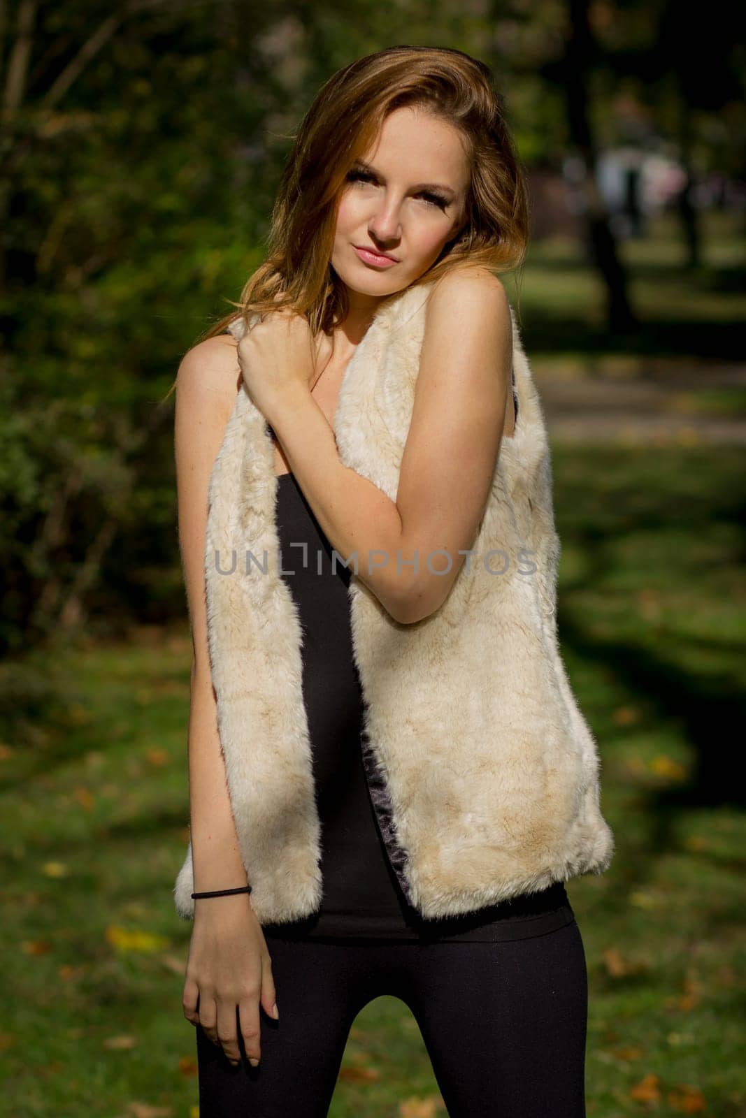 Young, beautiful woman in the city park