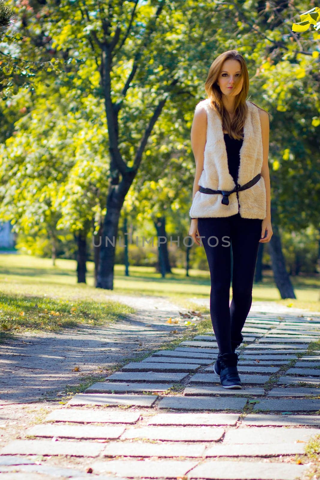 Young, beautiful woman in the city park