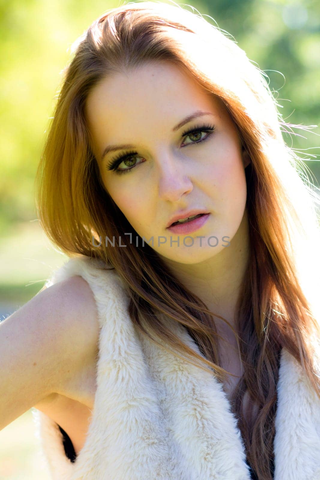 Young, beautiful woman in the city park