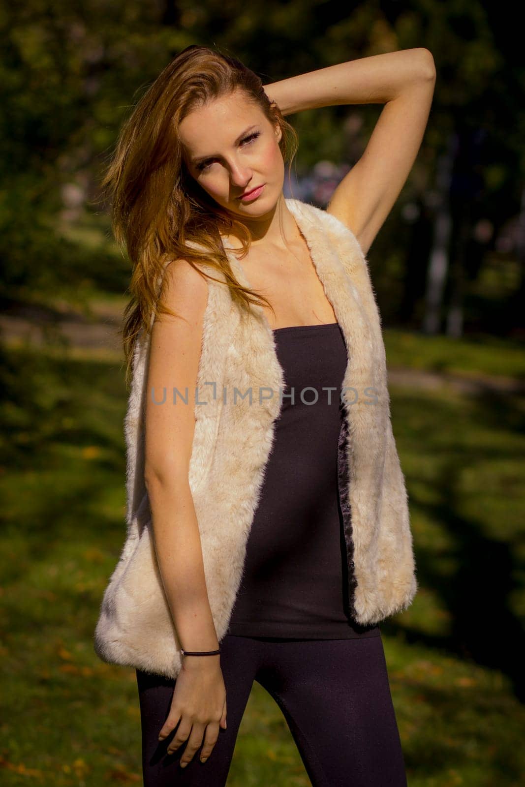 Young, beautiful woman in the city park