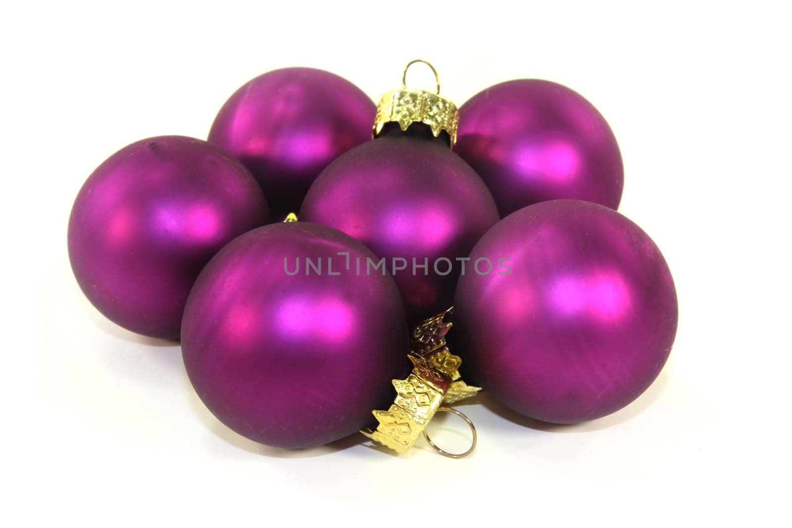 Violet Christmas baubles against white background