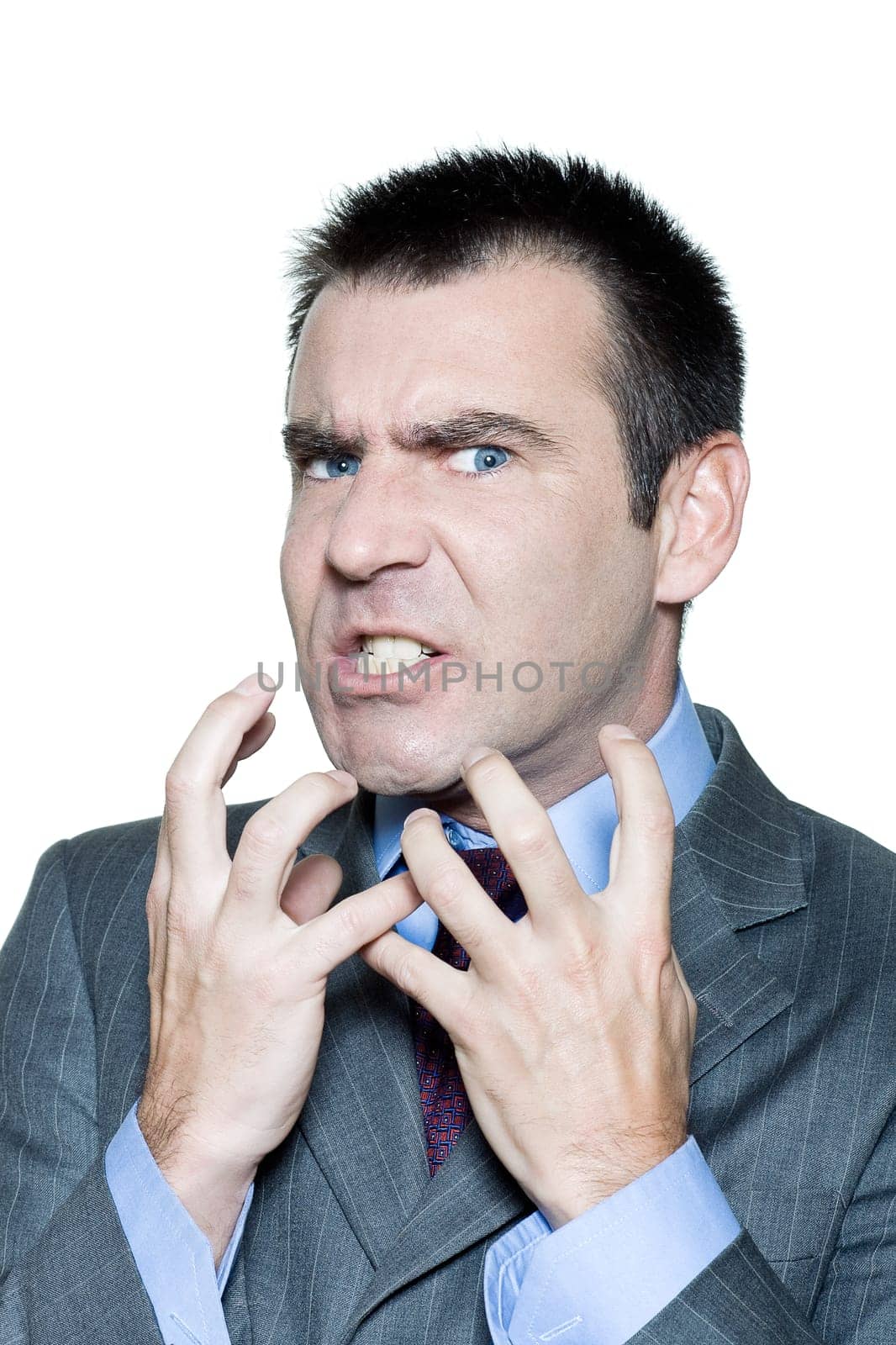 Closeup portrait of an expressive angry mature man in studio on isolated white background