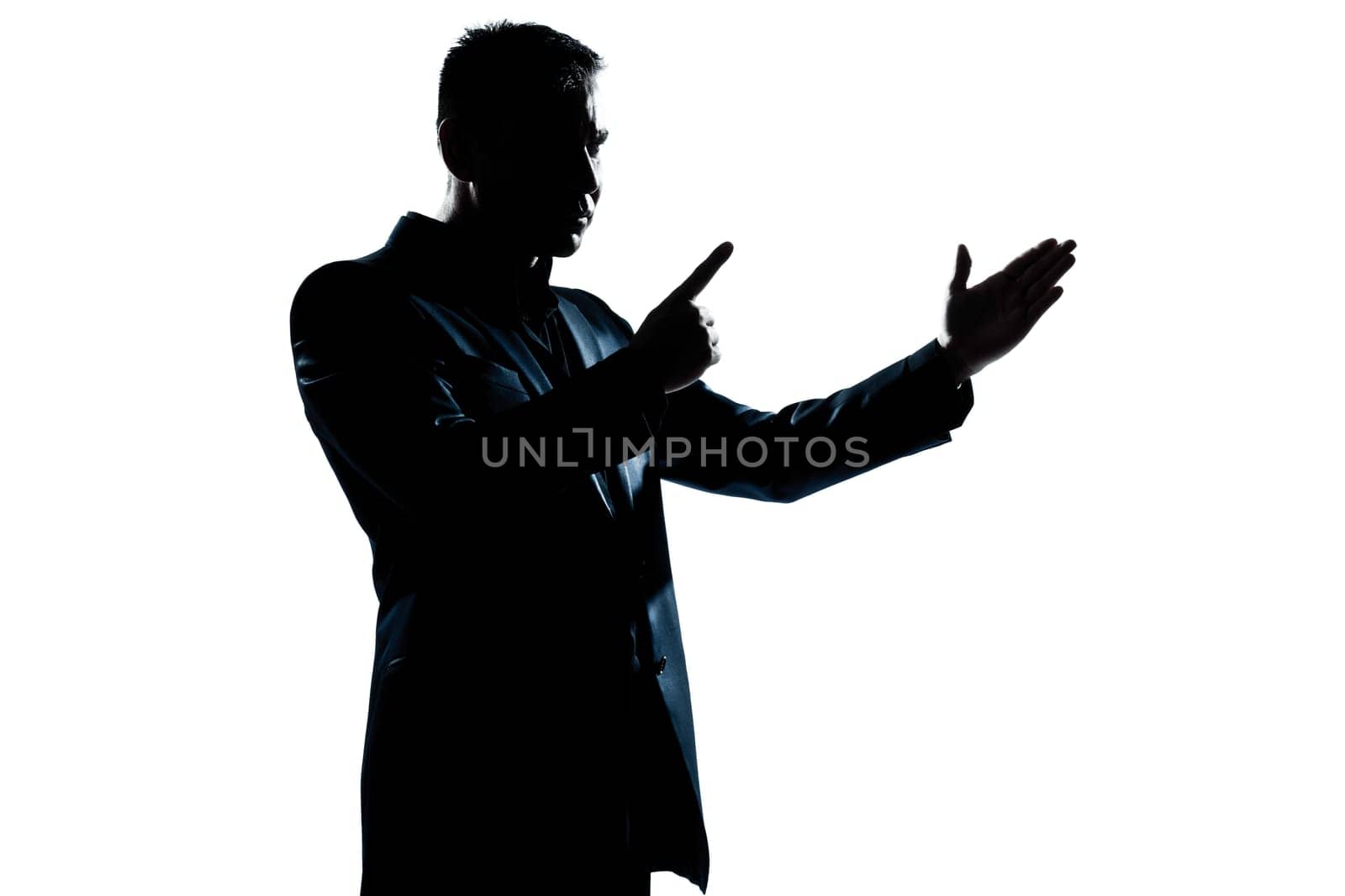 one caucasian man angry menacing portrait silhouette in studio isolated white background