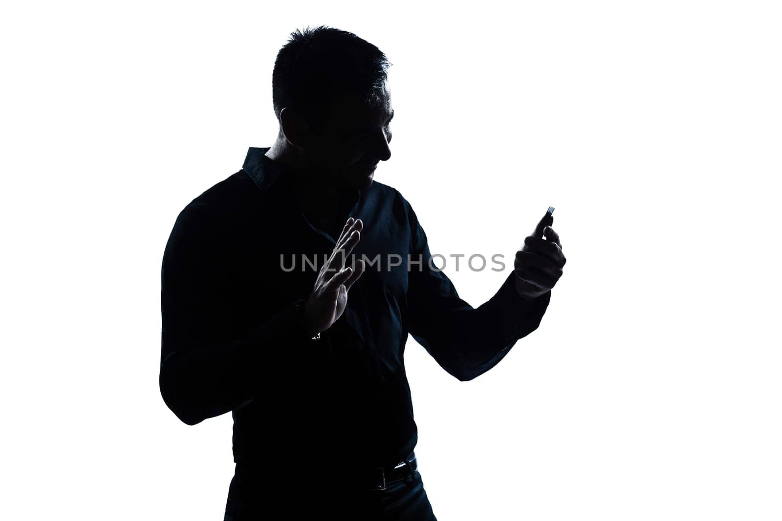 one caucasian man salute gesture telephone videophone  portrait silhouette in studio isolated white background