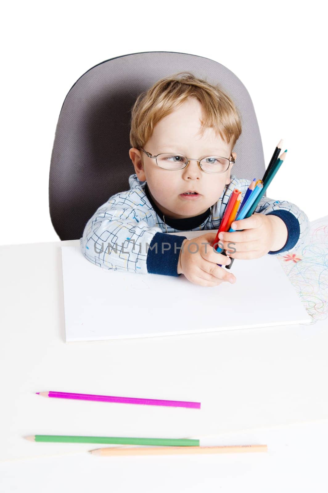 Portrait of the little boy with pencils