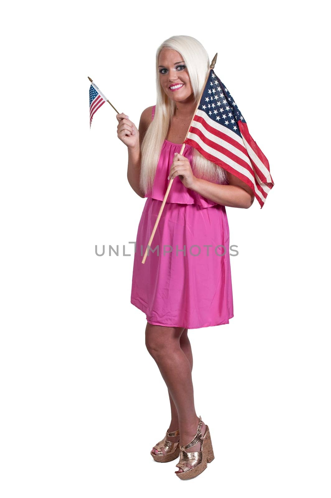 Beautiful young woman holding an American flag.