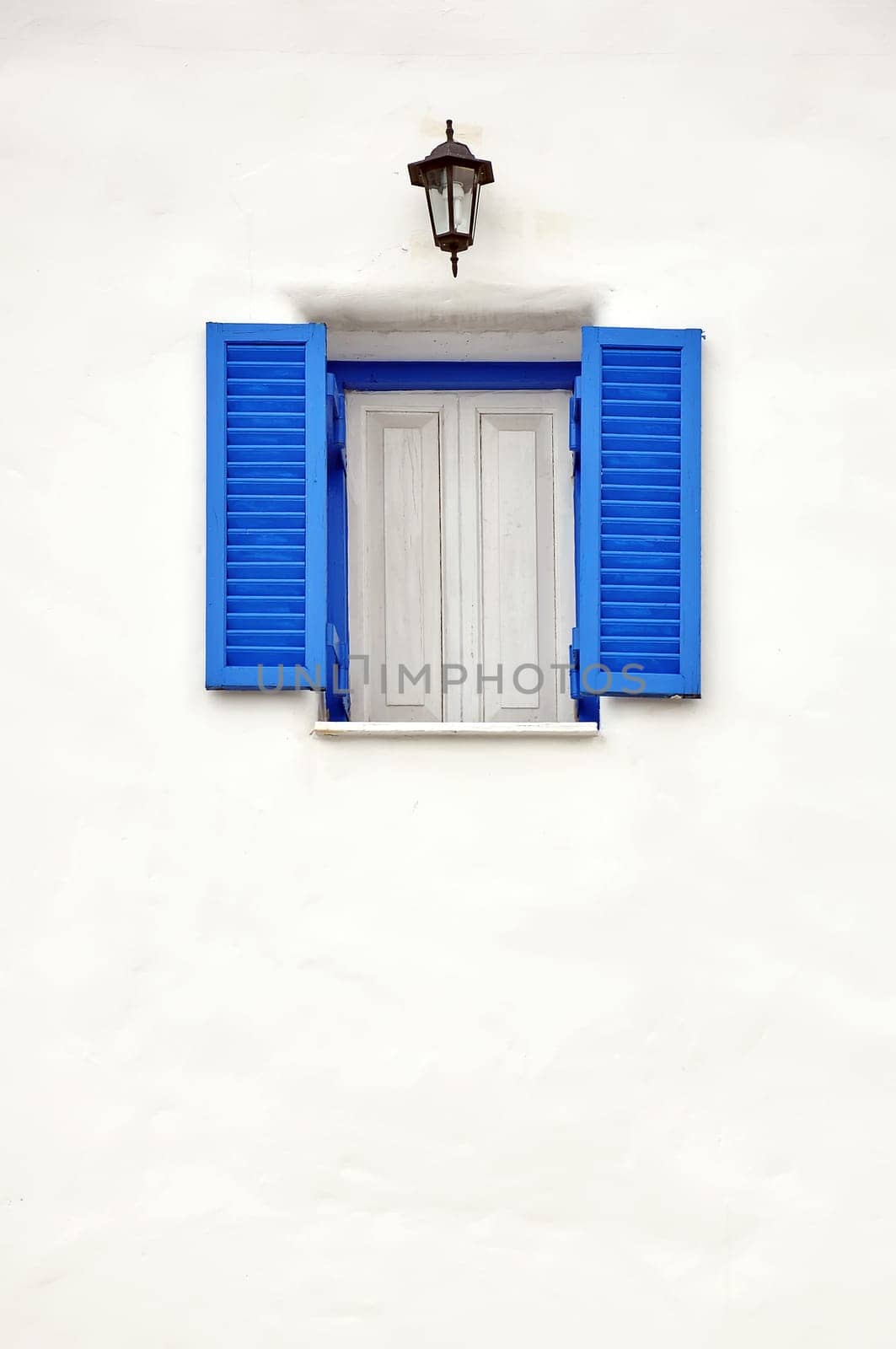 Blue window on white wall