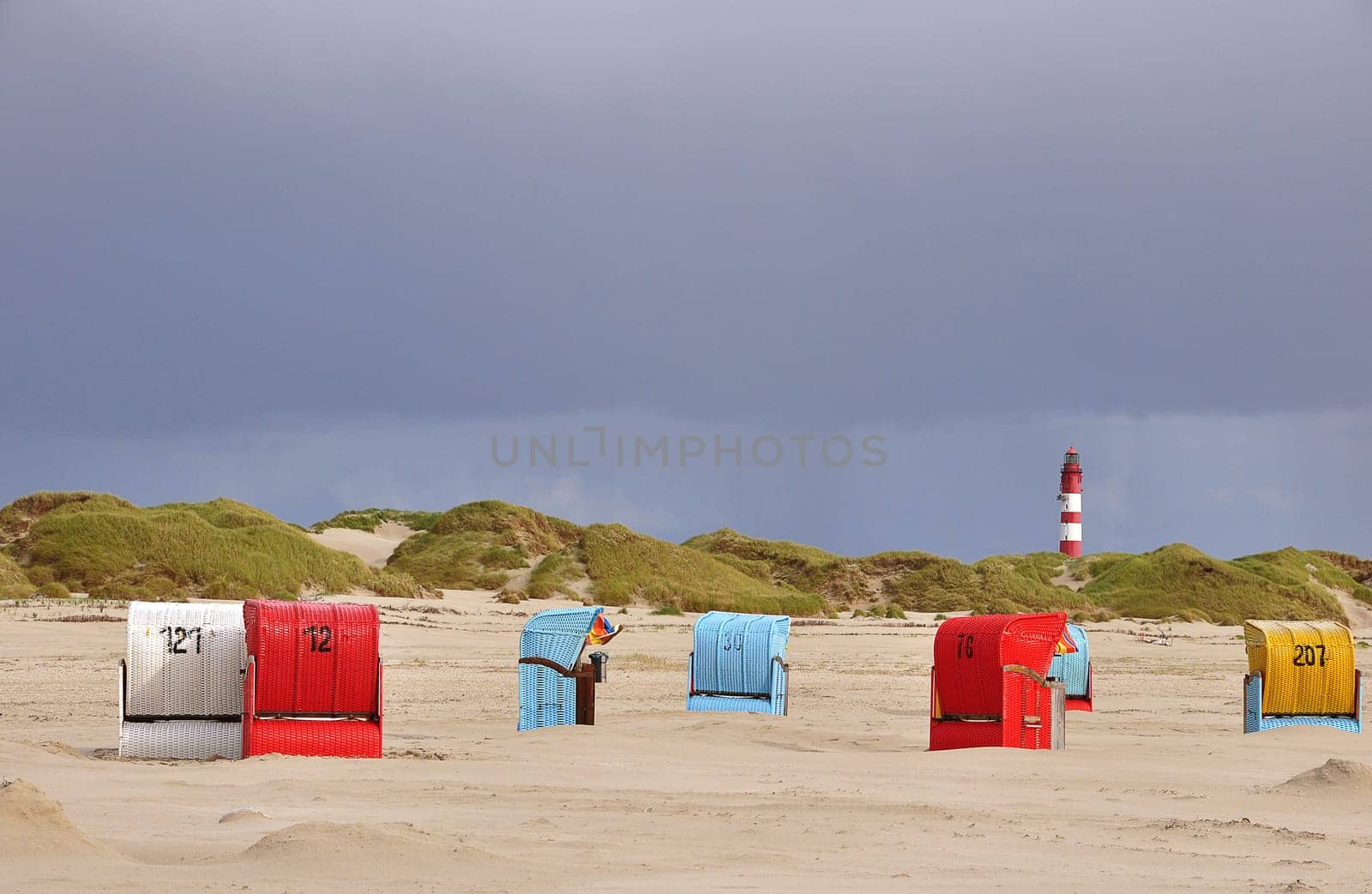 Beach chairs and lighthouse