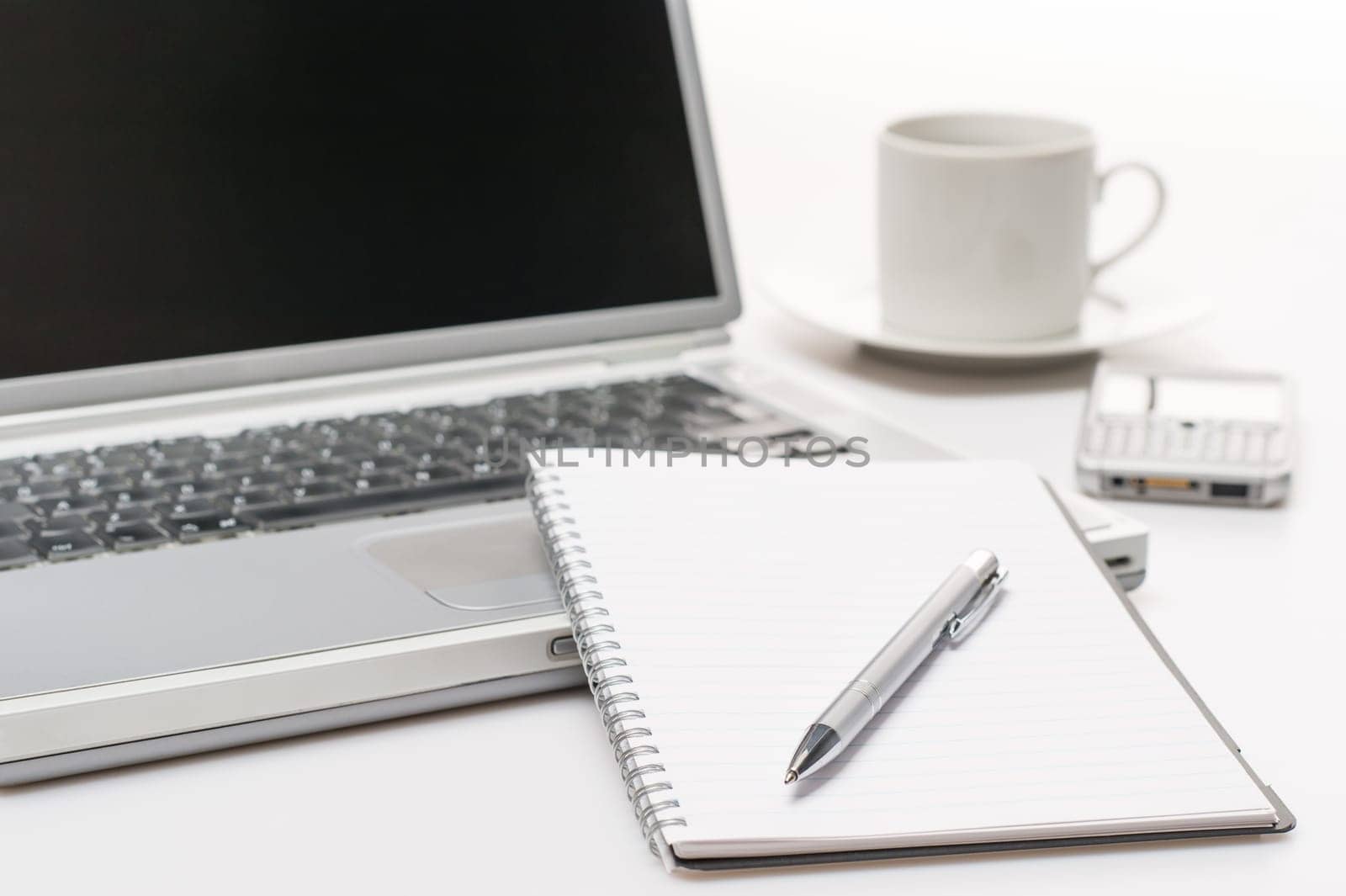 Business workplace pen notepad laptop phone coffee on office desk