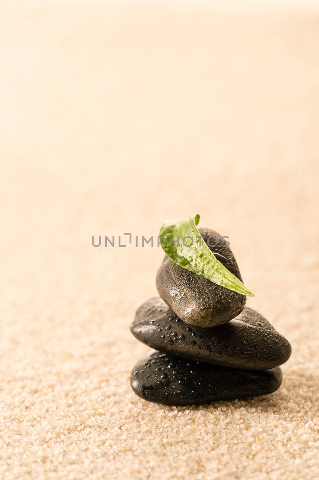Spa zen stones with leaf on sand still nature