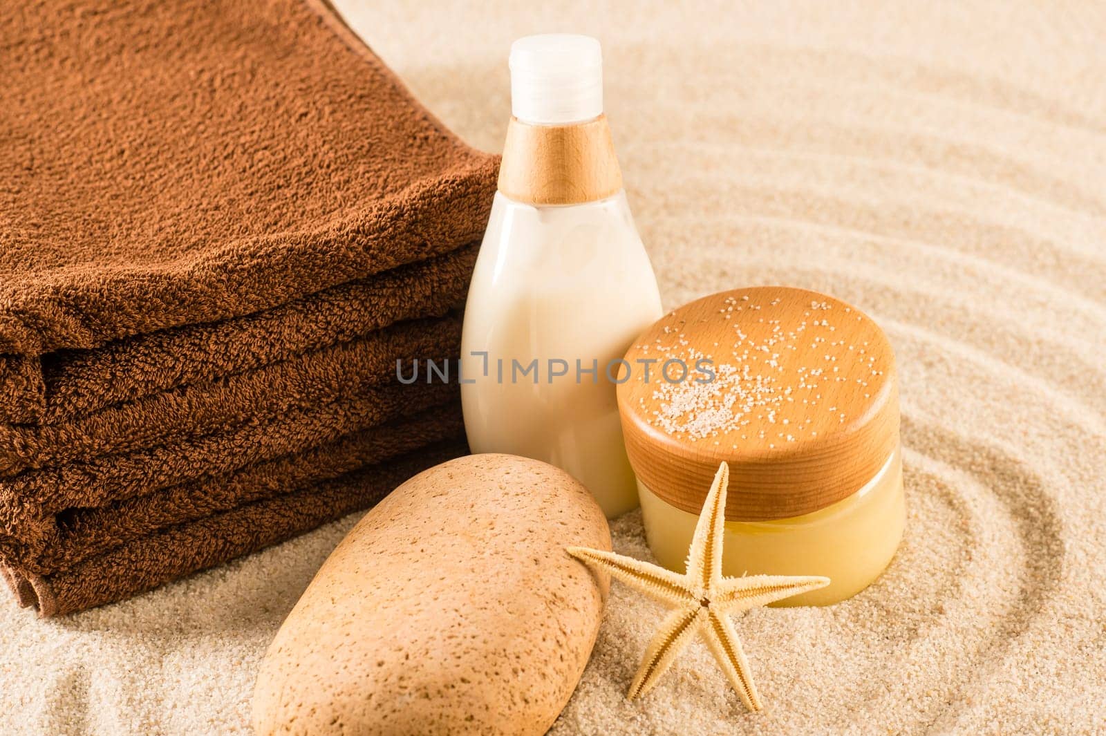 Spa beauty treatment products on sand natural body care
