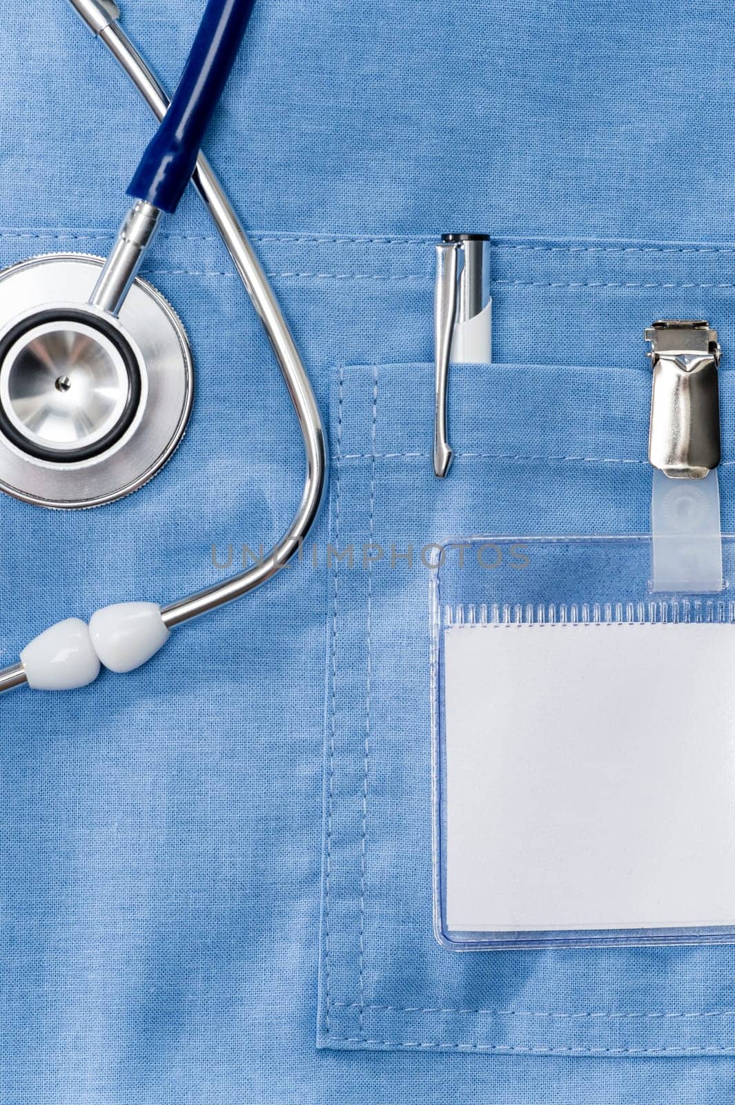 Doctor ID name tag on lab coat with stethoscope