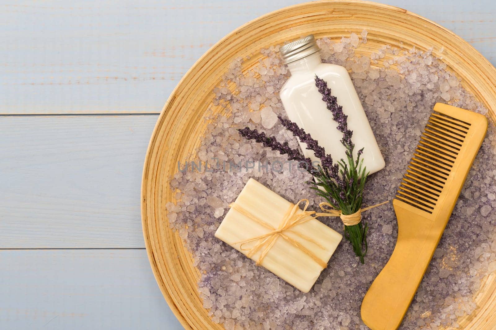 Natural lavender cosmetic products with comb on wooden tray