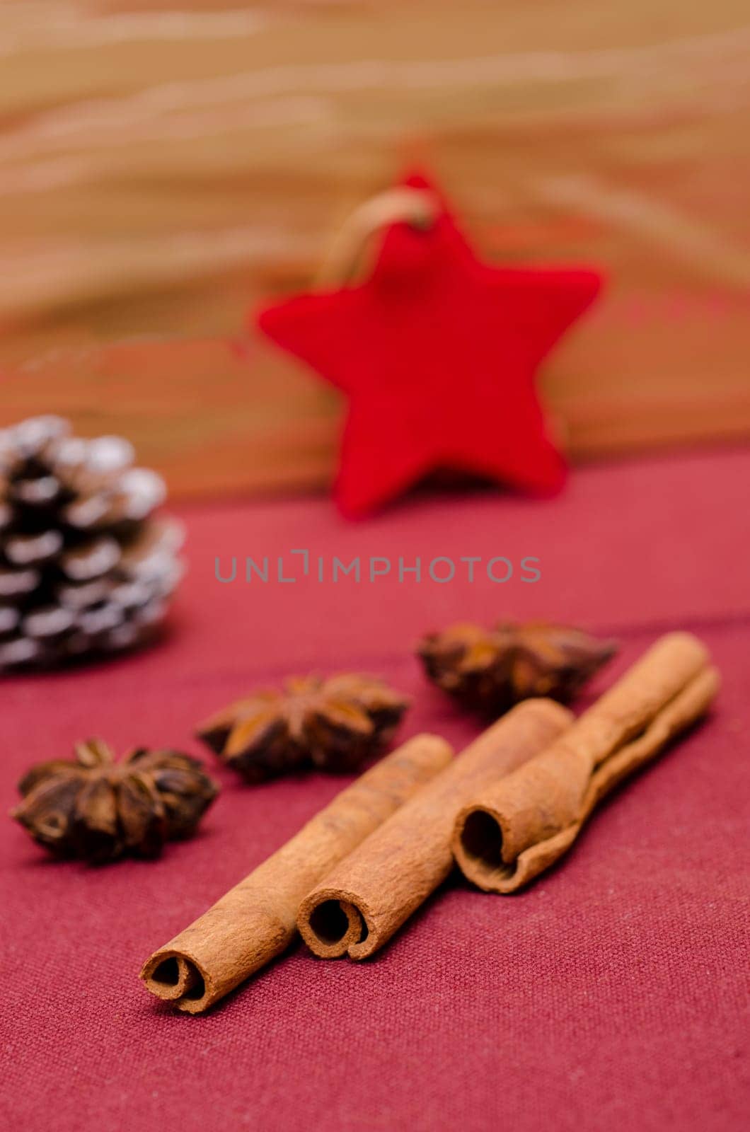 Cinnamon stick,star anise and red star on Advent