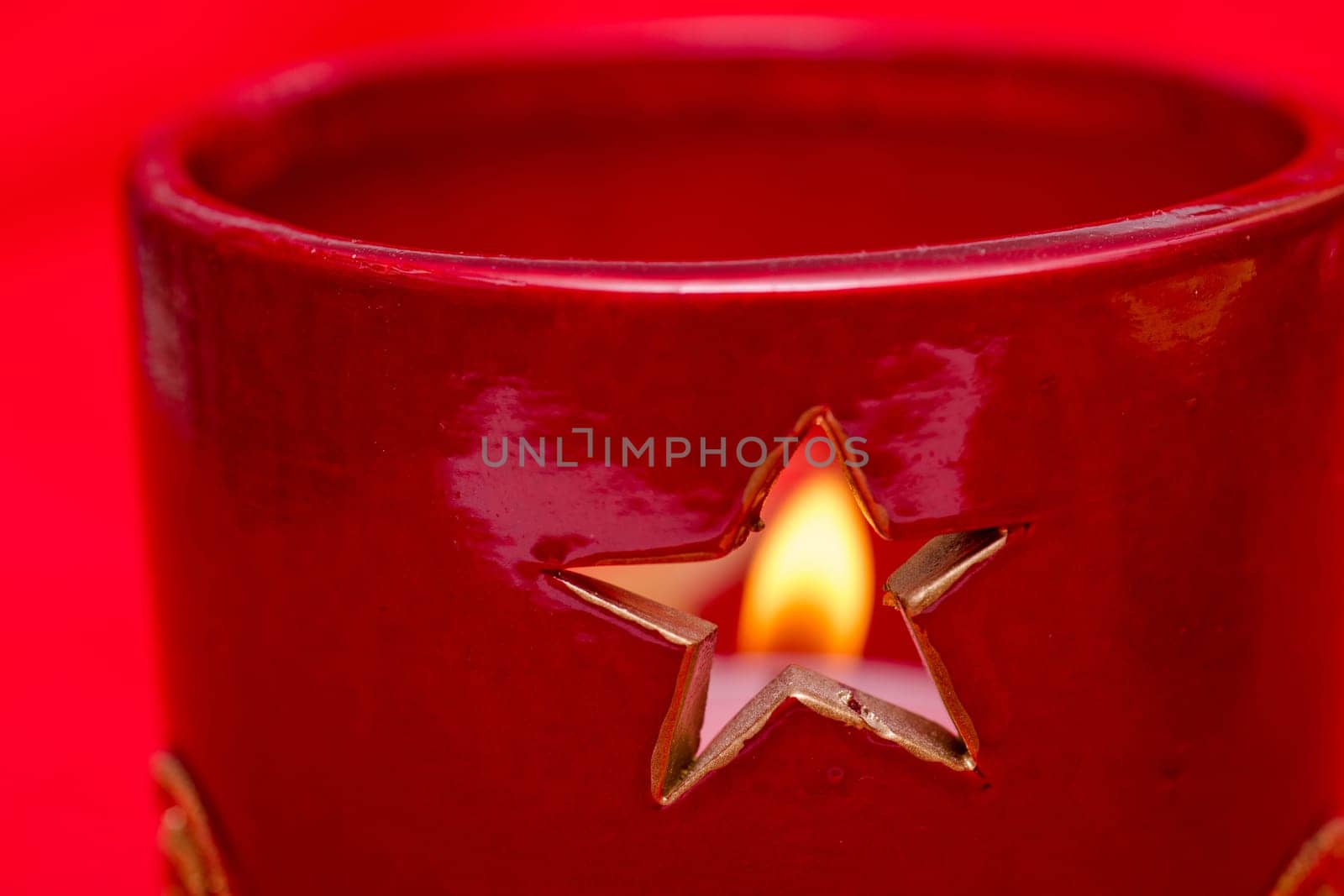 Star in a candlestick with a fuzzy flame of a candle