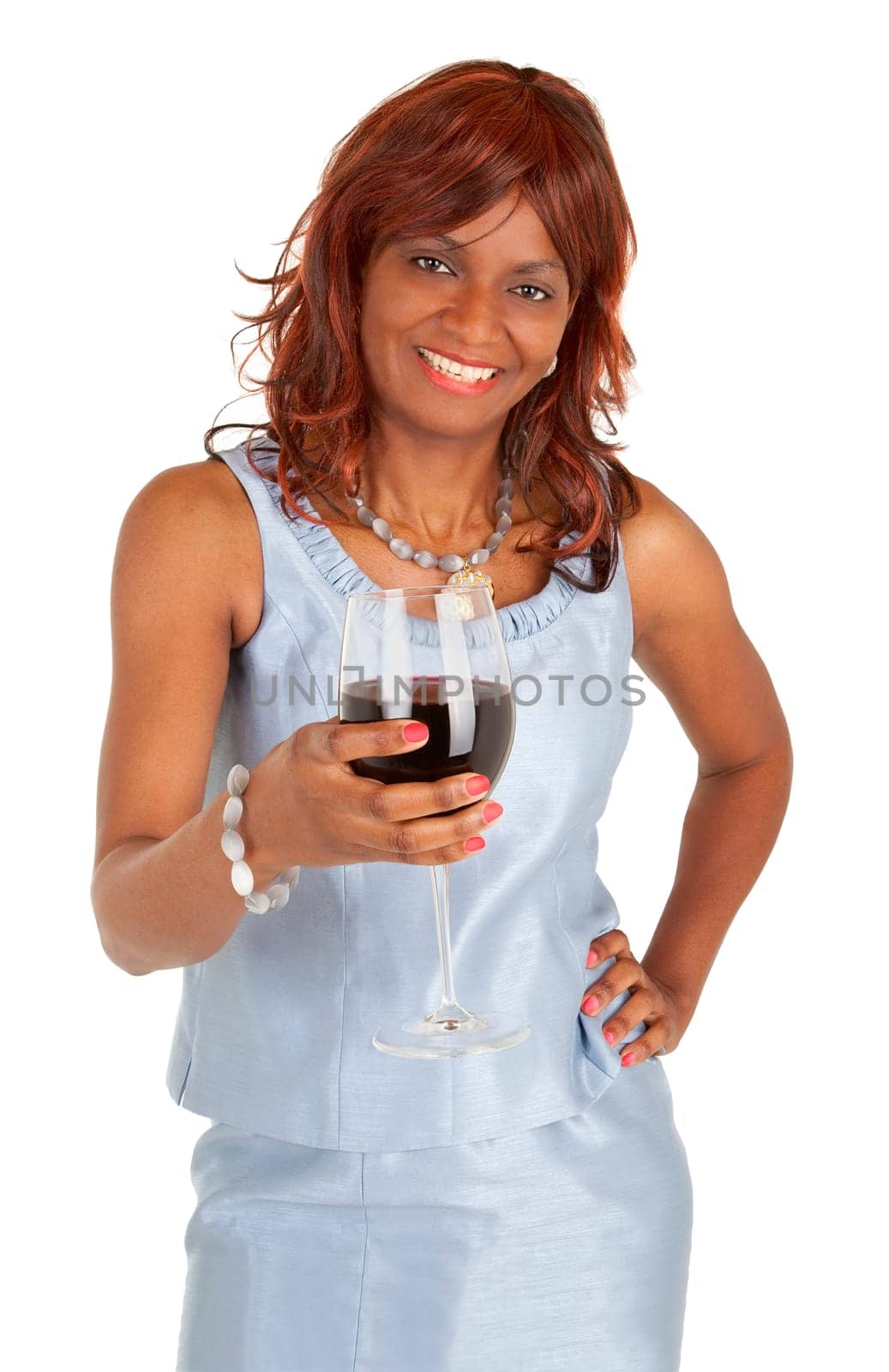 An happy african american woman is holding a glass of red wine.