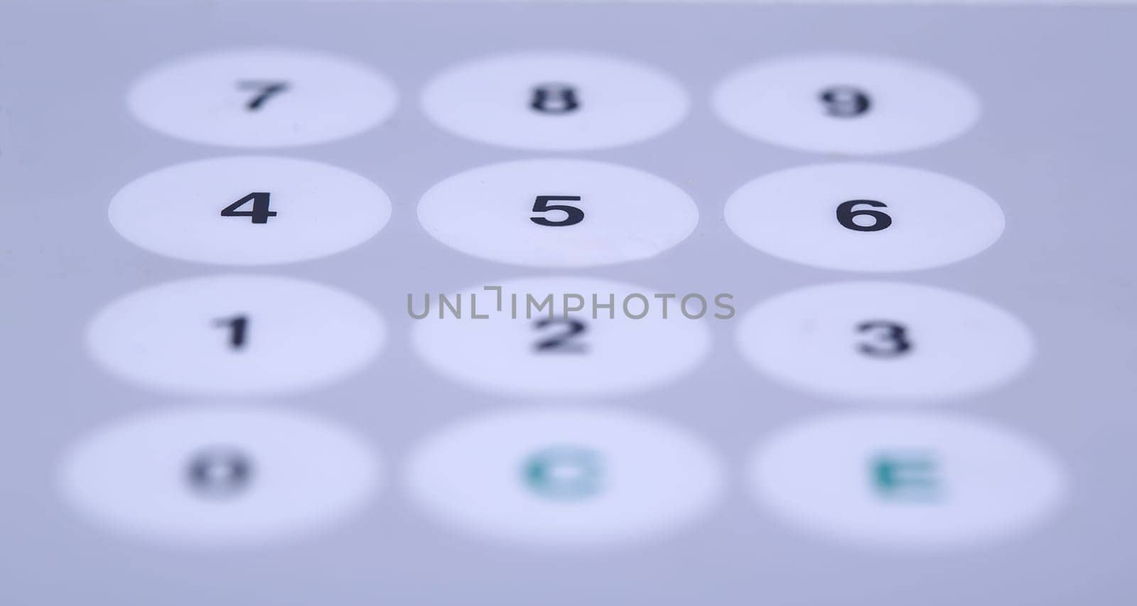 Wide white buttons on working desktop partially shaded