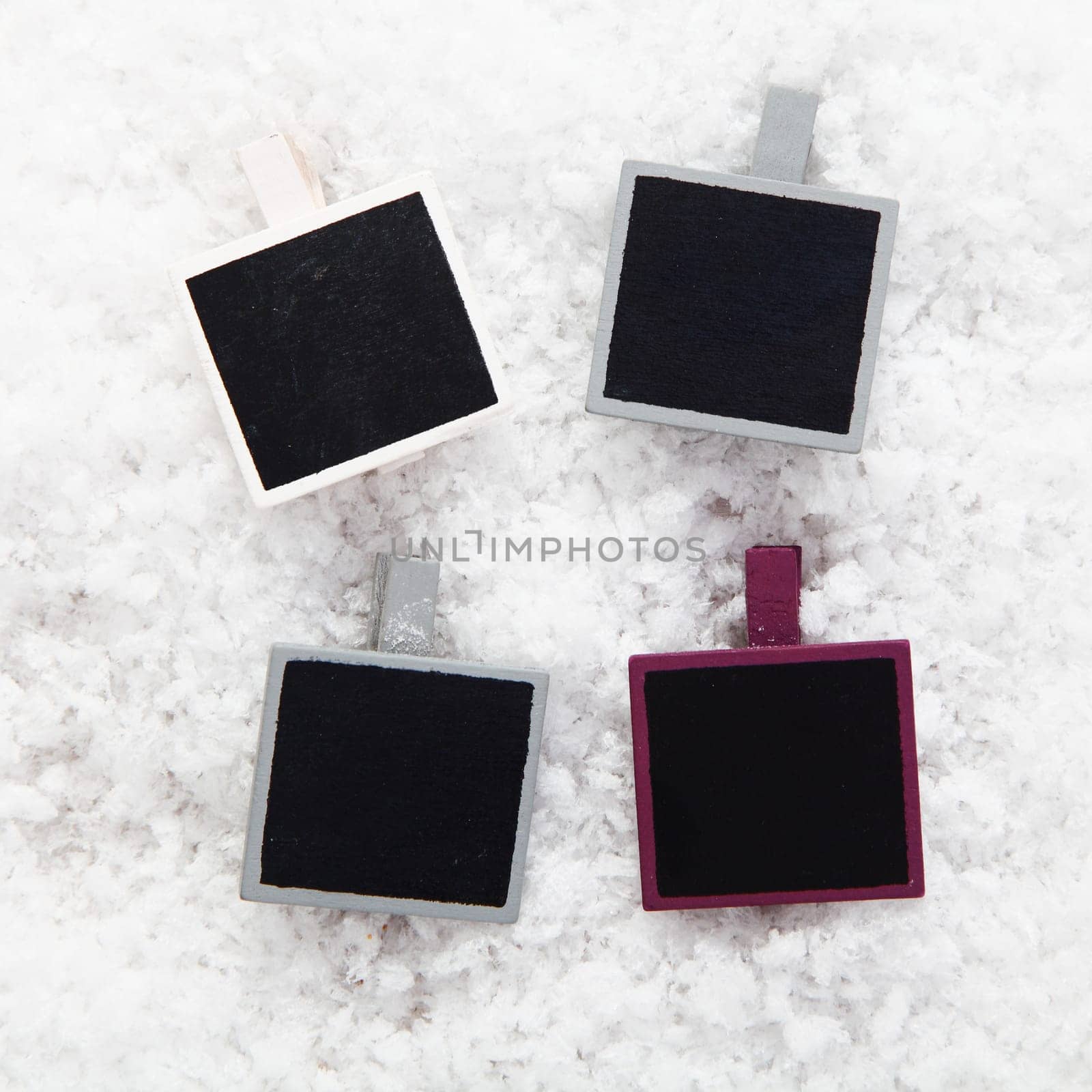 Four empty retro instant photo frames on snow for your collection of Christmas or seasonal images or messages